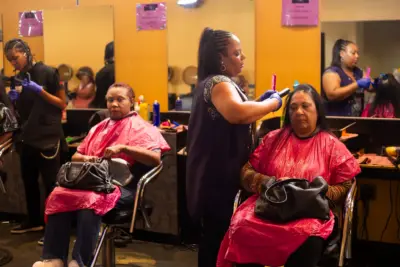 Two Pro Way students practice hair dying on clients.
